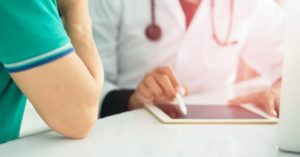 doctor using tablet