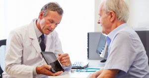 doctor showing patient tablet