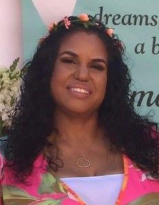 women with black hair smiling